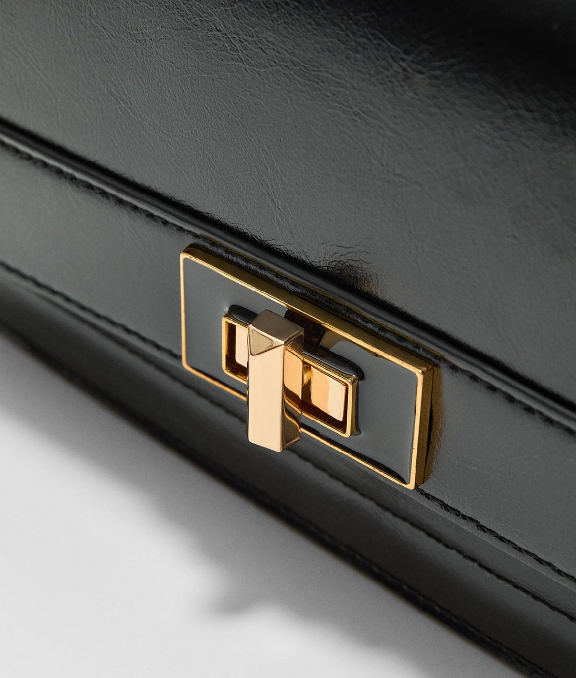 Crossbody bag with flap and painted closure